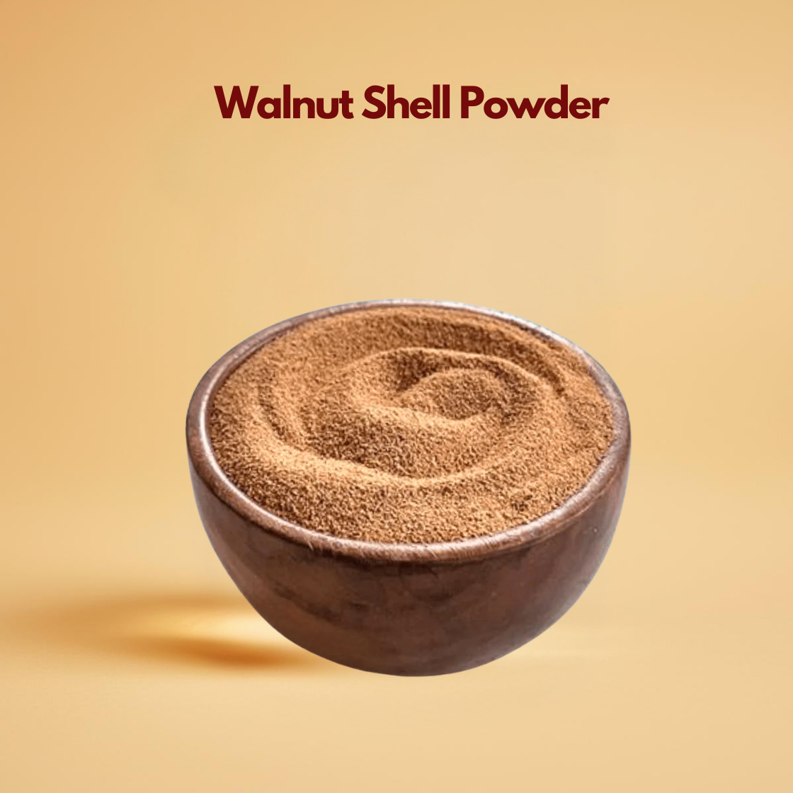 A rustic wooden bowl filled with fine, brown walnut shell powder on a warm beige background. Text above reads "Walnut Shell Powder." Clean and earthy tone.