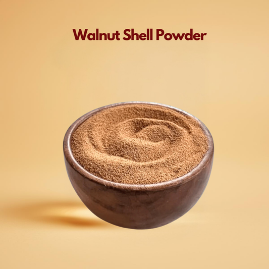 A rustic wooden bowl filled with fine, brown walnut shell powder on a warm beige background. Text above reads "Walnut Shell Powder." Clean and earthy tone.