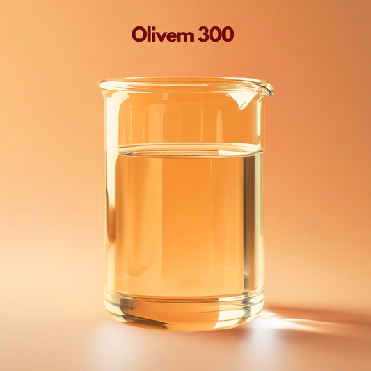 Transparent laboratory beaker containing golden clear liquid labeled Olivem 300 placed on a warm orange background. Olivem 300 is a cosmetic solubilizer and emollient derived from olive oil used in skincare formulations to disperse oils and improve skin feel.