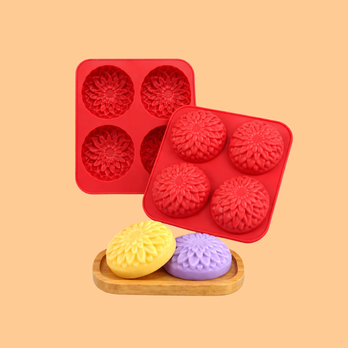 Red silicone soap mold trays with round floral cavities displayed with colorful finished flower shaped soaps on wooden tray, silicone mold used for artisan soap making, DIY bath products and decorative soap crafting.
