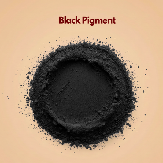 Round formation of black pigment powder with a dense matte center and loose mineral particles surrounding the outer ring. The powder appears ultra fine and highly pigmented. This cosmetic black pigment powder is commonly used in eyeliner and mascara.