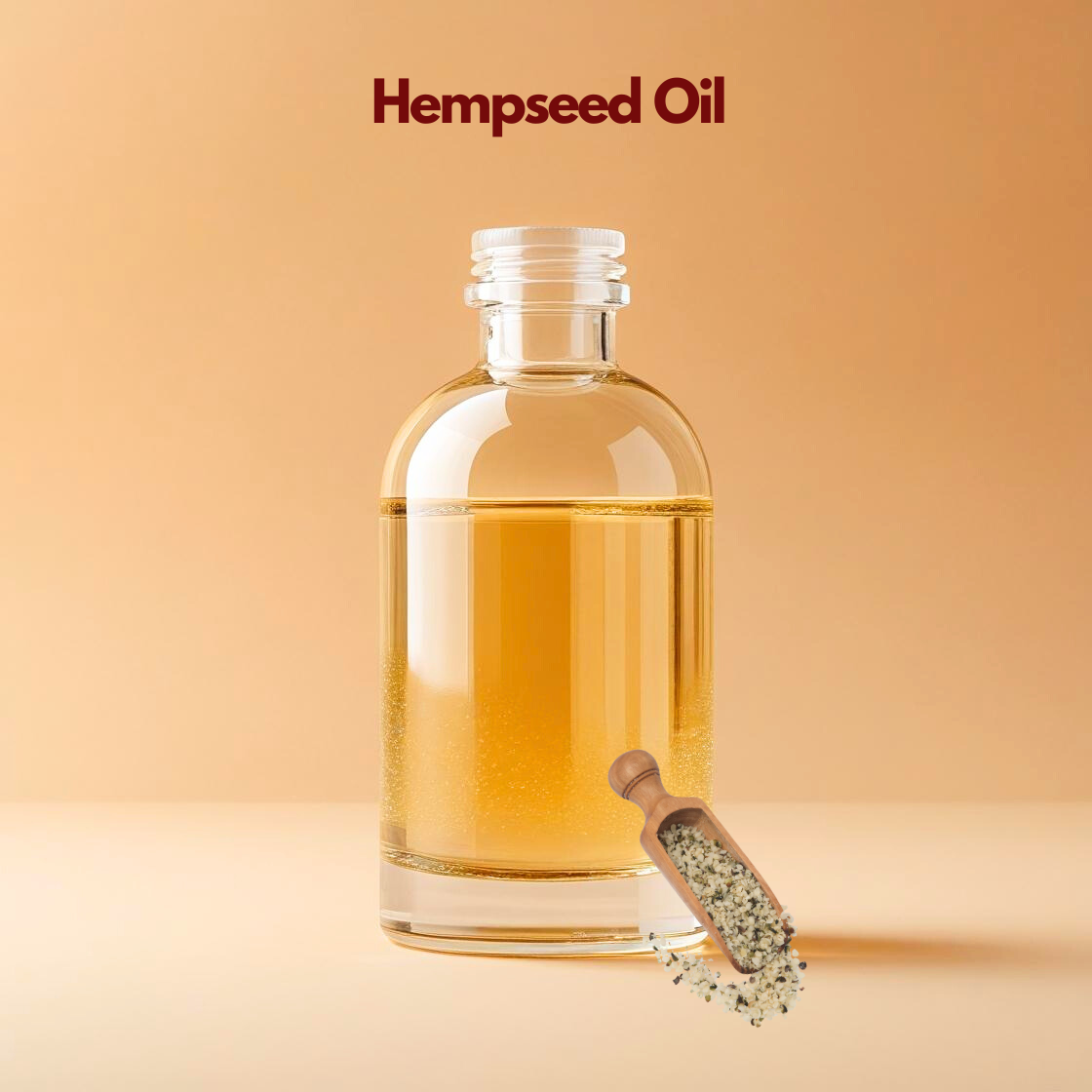 Cold pressed hempseed oil in clear bottle with hemp seeds, omega-rich carrier oil from our carrier oil collection for moisturizing creams, body oils and skincare products.