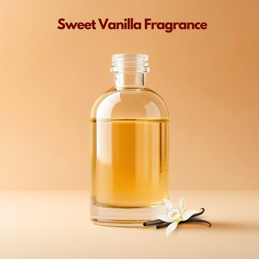 Glass bottle labeled Sweet Vanilla Fragrance with vanilla pods and a white vanilla flower placed beside it. This oil soluble fragrance for cosmetics offers a warm sweet aroma ideal for creams, lotions and soaps.