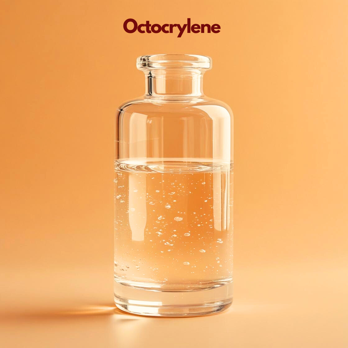 Clear glass bottle containing transparent liquid labeled Octocrylene placed on a warm orange background with small bubbles visible in the liquid. Octocrylene is a cosmetic UV filter commonly used in sunscreen and skincare formulations to help protect the skin from UV radiation.