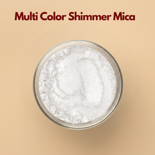 Multi color shimmer mica pigment powder in a transparent cosmetic jar placed on a neutral beige background. Cosmetic grade mica powder with reflective shimmer effect designed for lip gloss, soap making, resin art, bath products, makeup formulations, and DIY beauty applications. The image highlights the fine texture and soft holographic appearance of the mica pigment powder.