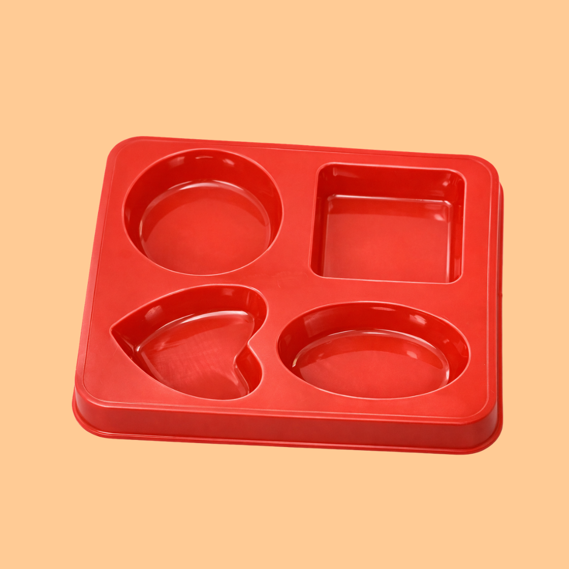 Red silicone multi shape soap mould tray displayed in the center with different shapes for handmade soap bars like heart shaped, oval shapes, square shapes, round shapes flexible mould used for melt and pour soap making, DIY soap crafting and artisan bath product production.