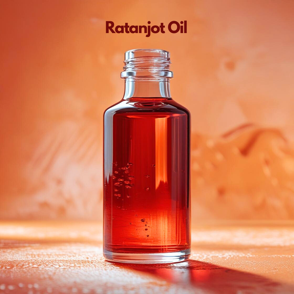 Ratanjot infused oil in clear glass bottle with deep red hue, herbal carrier oil from our carrier oil collection used for natural color infusion in lip balms, hair oils and cosmetic formulations.
