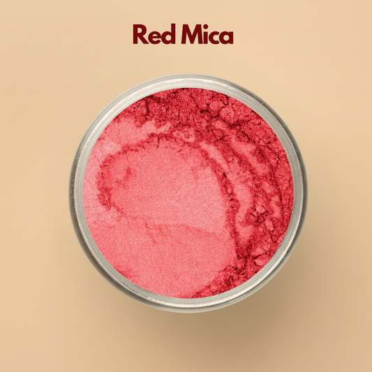 Red mica powder with bold shimmer pigment texture displayed in a round cosmetic jar on a beige background. Cosmetic grade red mica pigment suitable for soap making, lip products, skincare formulations, candles, makeup products, resin art, and DIY cosmetic manufacturing. The image highlights vibrant red shimmer and finely processed cosmetic pigment powder.