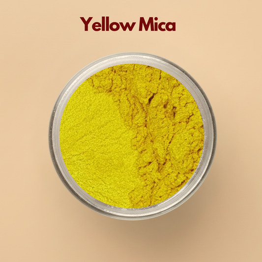 Yellow mica pigment powder in a transparent cosmetic container with bright yellow shimmer texture on a neutral beige background. Cosmetic grade mica powder used for soap making, bath bombs, makeup formulations, skincare products, resin art, and DIY beauty products. The image shows vibrant yellow cosmetic pigment powder with smooth finely milled texture.