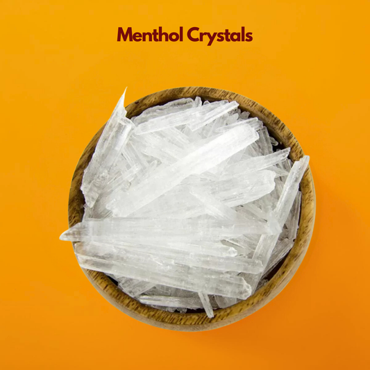  Wooden bowl filled with long translucent menthol crystals labeled Menthol Crystals placed on a vibrant orange background. Cosmetic grade menthol crystals are widely used in skincare haircare and personal care formulations to provide a cooling refreshing sensation.