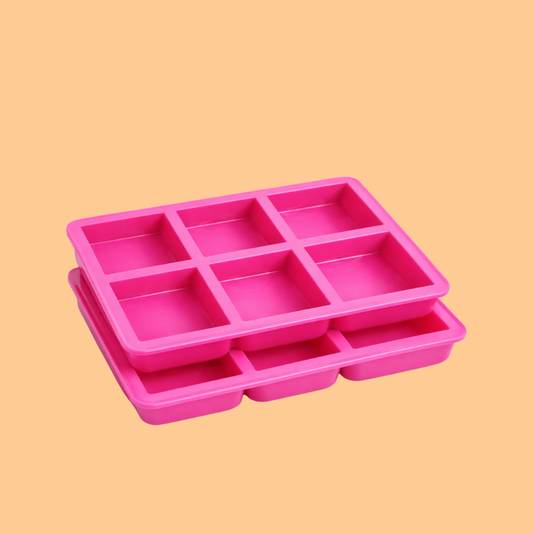 Pink silicone soap mould tray with six square cavities stacked together, durable silicone mold used for handmade soap bars, DIY melt and pour soap making, and cosmetic soap production.