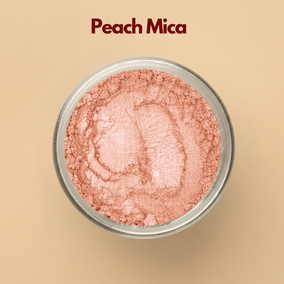 Peach mica pigment powder in a transparent cosmetic container with soft peach shimmer finish on a beige background. Cosmetic grade mica powder designed for lip gloss, soap making, skincare, makeup formulations, body shimmer products, and DIY cosmetic creations. The image showcases elegant peach shimmer and finely milled cosmetic pigment texture.