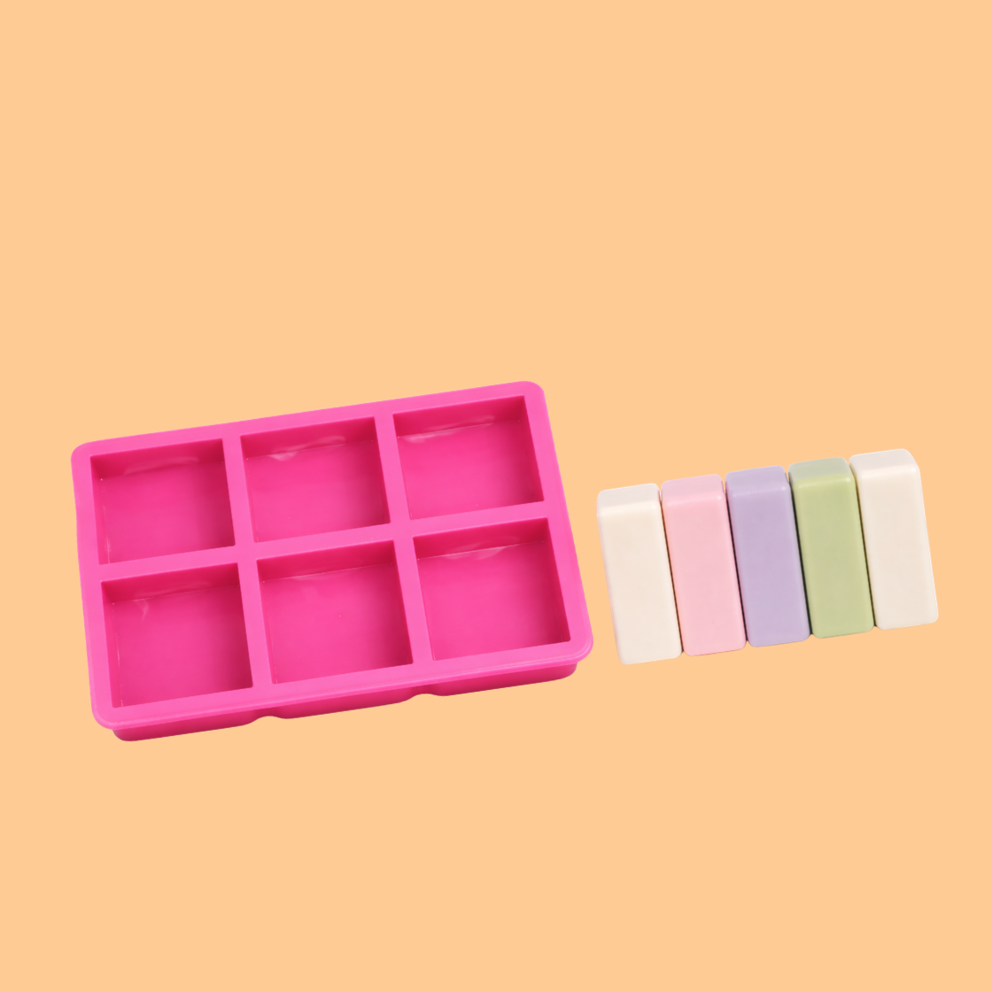Pink silicone square cavity soap mould tray displayed with colorful rectangular handmade soap bars, reusable silicone mold used for artisan soap making, bath product crafting, and cosmetic manufacturing.