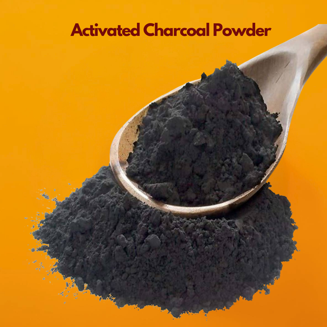 A clear glass bowl containing a heap of deep, jet black "Activated Charcoal Powder". The powder is very fine and matte, contrasting sharply against the vibrant solid orange background it is placed upon. The text "Activated Charcoal Powder" is displayed at the top in bold maroon.