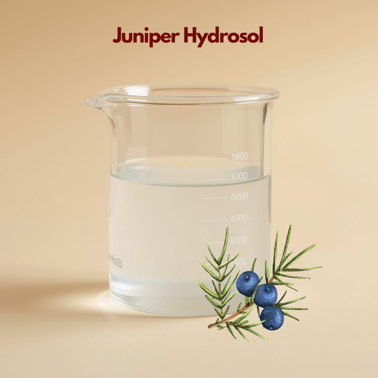 Beaker filled with transparent liquid labeled Juniper Hydrosol with illustrated juniper berries and needles. This juniper hydrosol floral water is presented as a clarifying and balancing skincare mist.