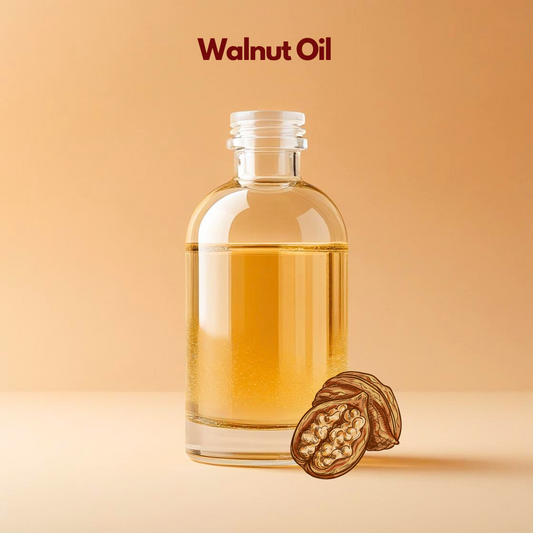 Walnut oil in transparent bottle with cracked walnut illustration, nutrient rich carrier oil from our carrier oil collection suitable for anti aging skincare, hair nourishment oils, and cosmetic formulations.