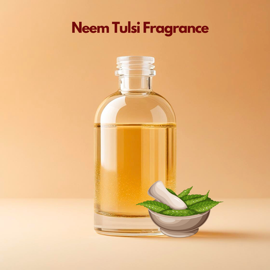 Glass bottle filled with golden liquid labeled Neem Tulsi Fragrance with a mortar and fresh green leaves illustration. This oil soluble fragrance for cosmetics reflects a herbal aromatic blend suitable for natural and ayurvedic style cosmetic products.