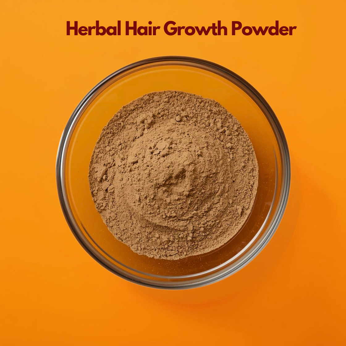 Top view of Herbal Hair Growth Powder in a transparent glass bowl, featuring fine beige brown botanical powder against a vibrant orange backdrop. Natural herbal blend formulated for hair strengthening, scalp nourishment and Ayurvedic hair care treatments.