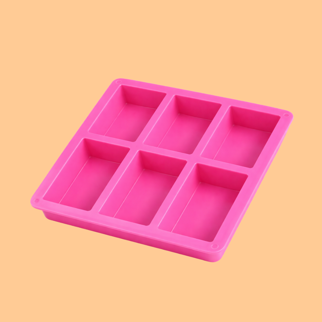 Pink silicone rectangular soap mould tray with six deep rectangular cavities designed for handmade soap bars, flexible silicone mold used for melt and pour soap making, cold process soap crafting and cosmetic product manufacturing.