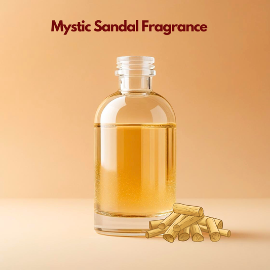 Clear glass bottle filled with golden oil labeled Mystic Sandal Fragrance displayed on a warm beige background with sandalwood sticks placed at the base. This oil soluble sandalwood fragrance oil is ideal for soaps, candles, attars, and cosmetic formulations, offering a rich woody aroma that adds depth and long lasting warmth to personal care products.