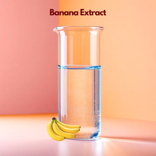 A transparent laboratory beaker filled halfway with clear liquid is displayed on a warm gradient background labeled “Banana Extract,” with ripe bananas placed at the base. This cosmetic grade fruit extract is used in skincare and haircare formulations for hydration support, nourishment and enhancing natural cosmetic performance.