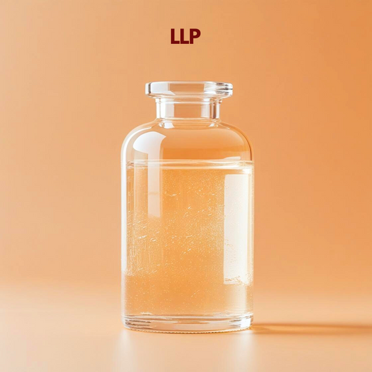 Clear glass bottle filled with transparent liquid labeled LLP positioned on a warm orange background with soft lighting. LLP is used in cosmetic formulations as a liquid ingredient that improves product texture stability and performance in skincare and personal care products.