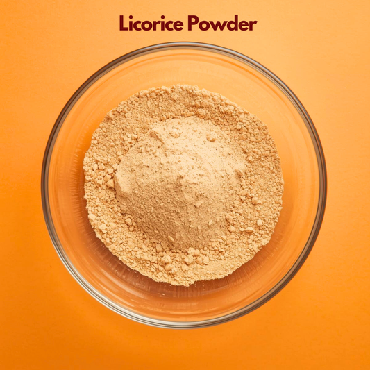 Top view of Licorice Powder in a clear glass bowl, showing fine pale beige herbal powder with soft granules against a bright orange background. Ayurvedic botanical powder widely used in skincare for brightening, soothing and natural cosmetic formulations.
