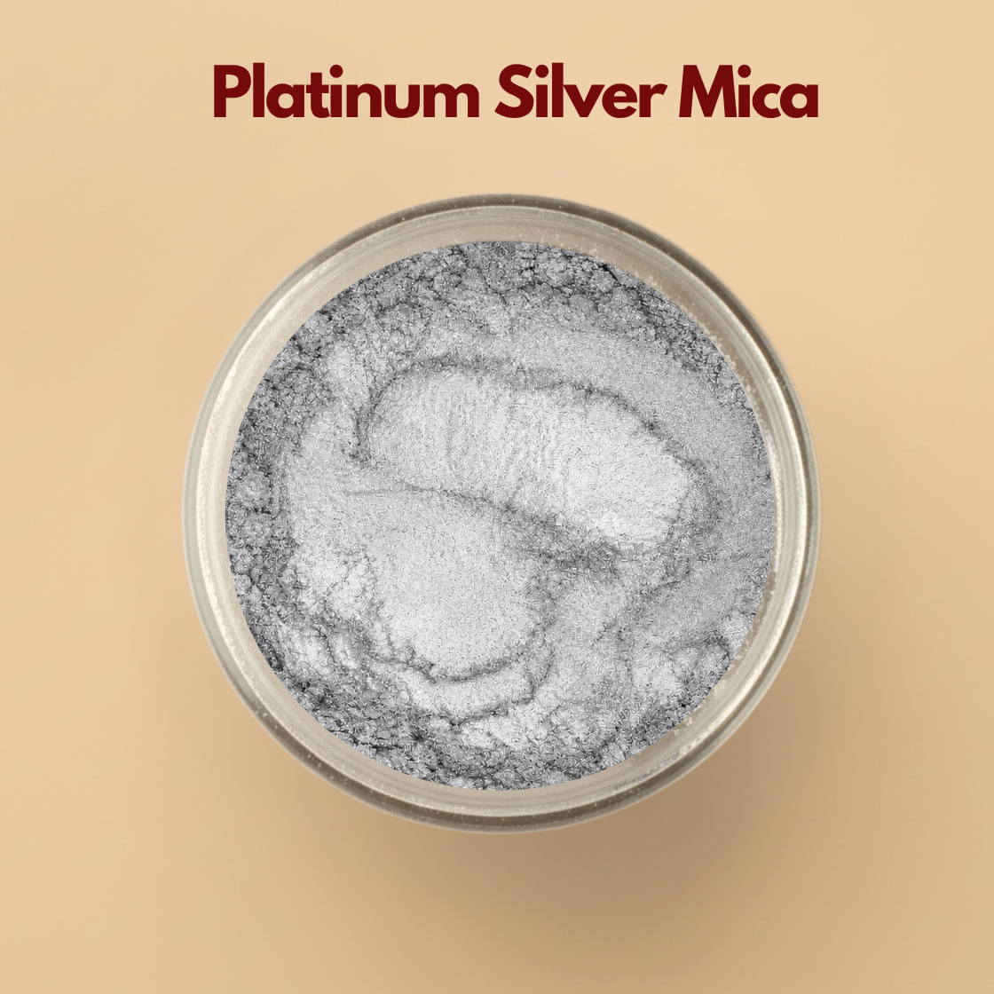 Platinum Silver cosmetic grade mica powder displayed in a round transparent container on a beige background for skincare, soap making, makeup, lip gloss, and DIY cosmetic formulations. The image shows finely milled silver mica pigment powder with metallic shimmer texture used by cosmetic formulators and beauty brands for creating reflective shimmer effects in handmade and professional beauty products.
