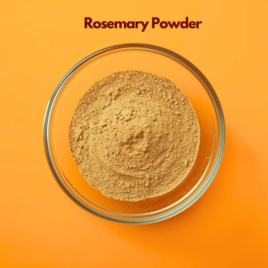 Top view of Rosemary Powder in a transparent glass bowl, showing finely ground herbal powder with earthy green brown tones on an orange background. Natural botanical ingredient used in hair care products, scalp treatments and herbal cosmetic formulations.