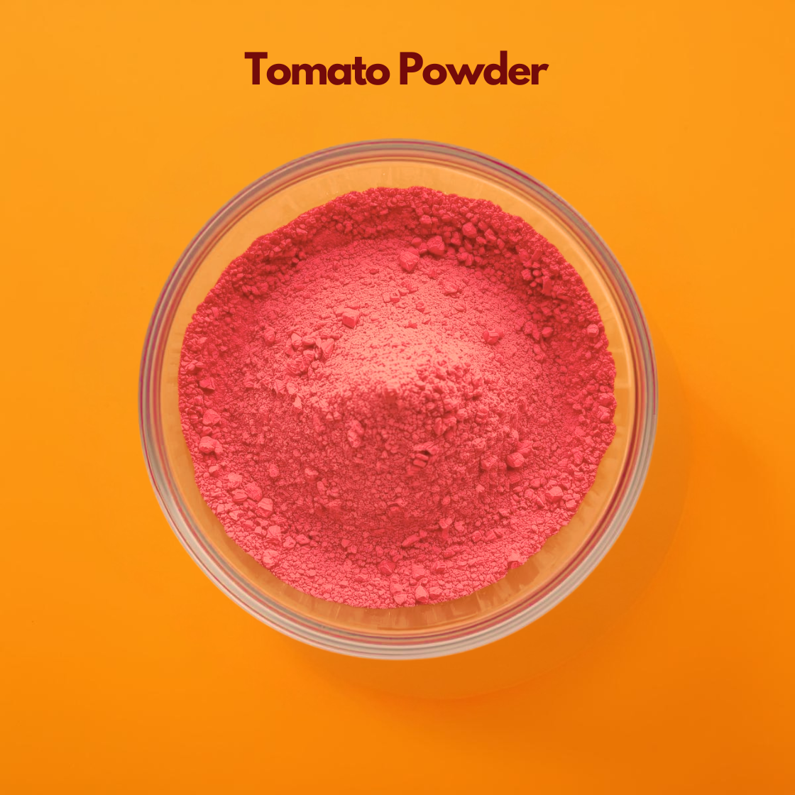 Tomato powder in a glass bowl, vibrant red natural powder used for skin brightening, tan removal, and DIY face masks, rich in antioxidants and widely used in skincare and cosmetic formulations.